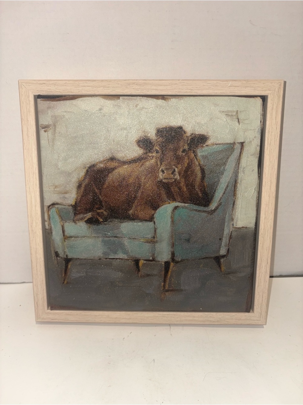 Framed Rustic Cow on Blue Chair Canvas Art